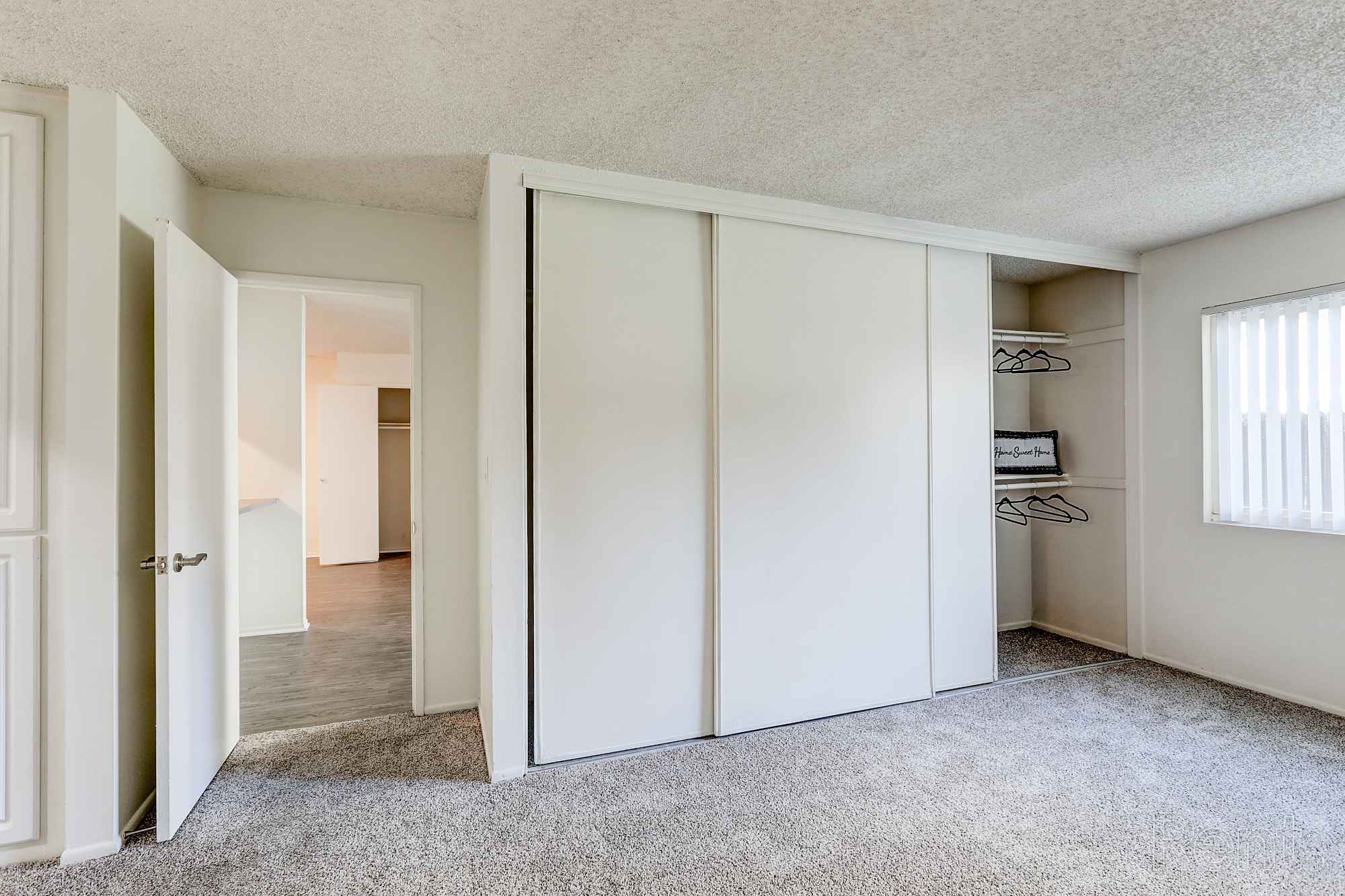 bedroom showing closet and hallway floorplan j at Chateau de Ville