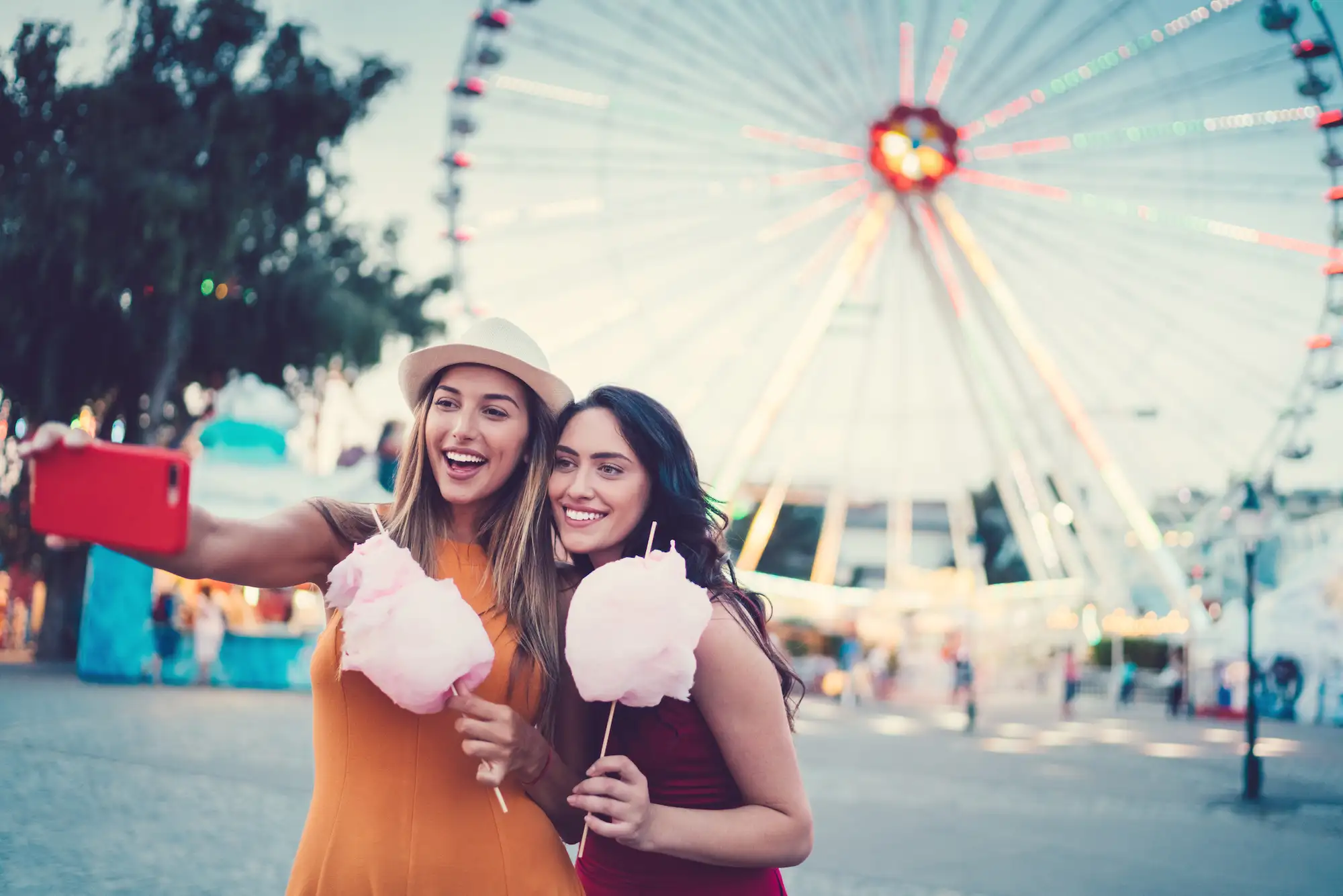 Women having fun at a local fair near Chateau de Ville Apartments